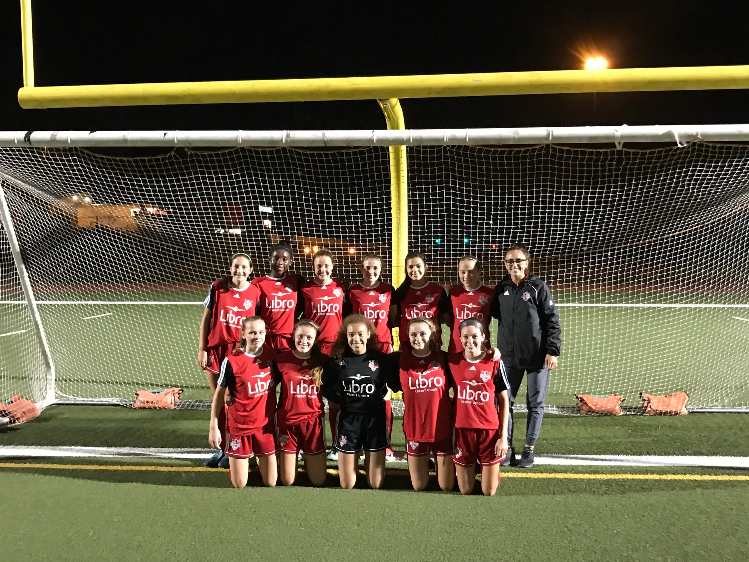 A team Jade coached, lined up in front of the goal